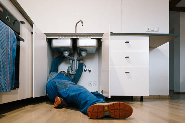 Professional Plumbing technician working in Roland, AR